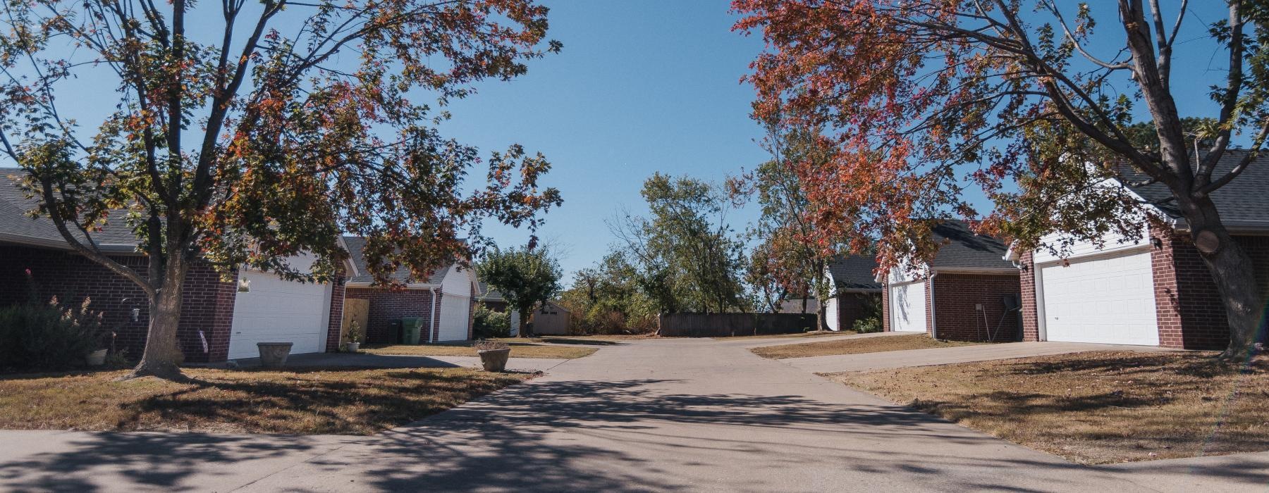a street with trees and houses