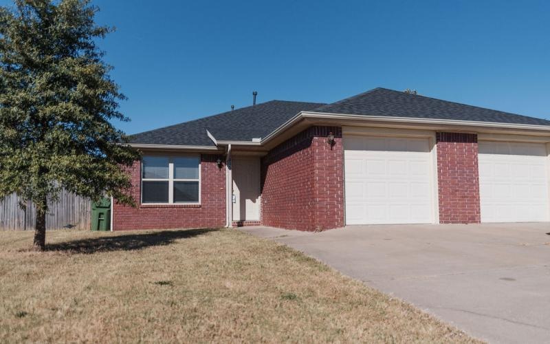 large driveway with multiple garages